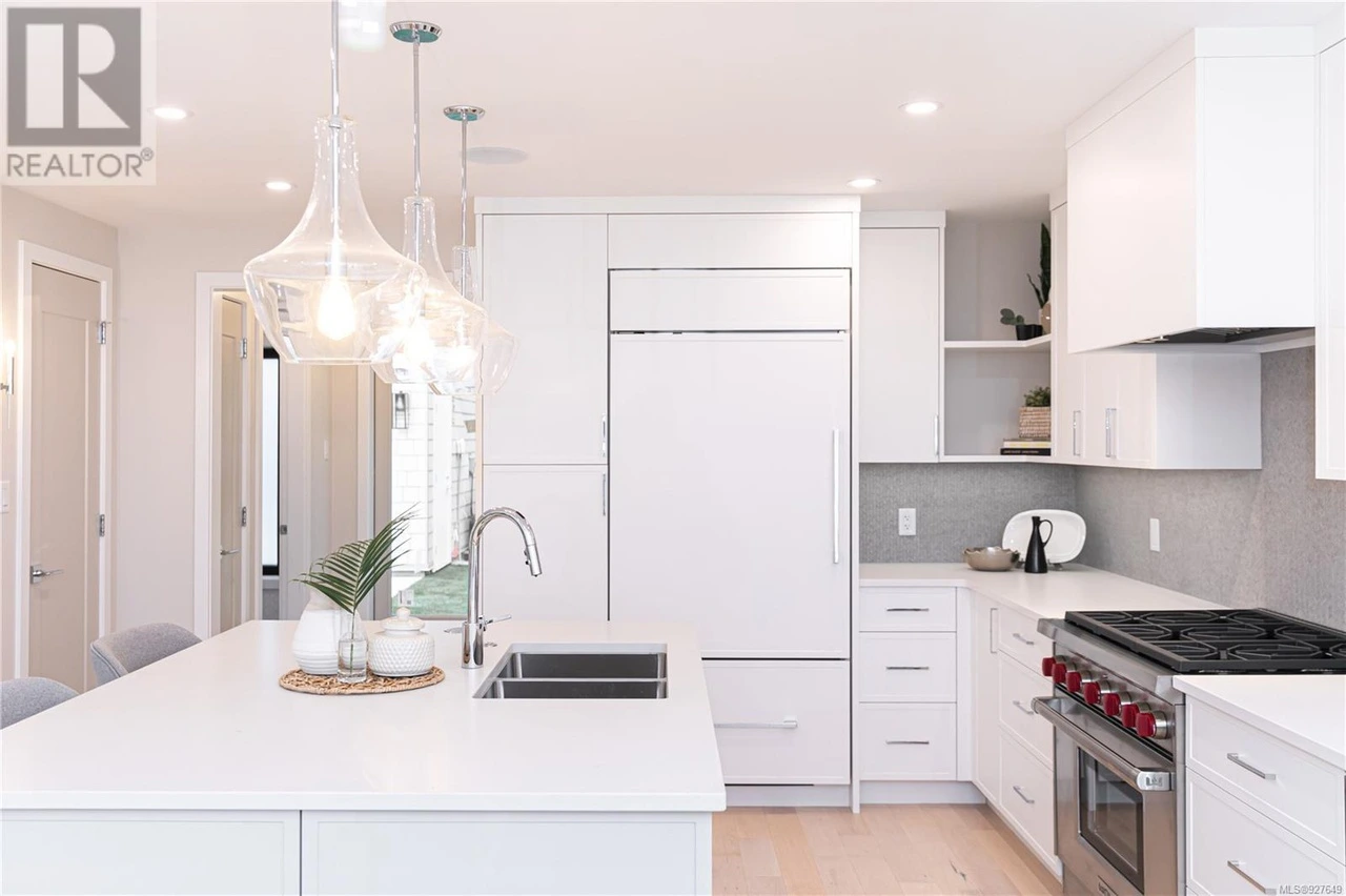 Kitchen Island & Dining Central island with pendant lighting connecting to dining area with clean lines
